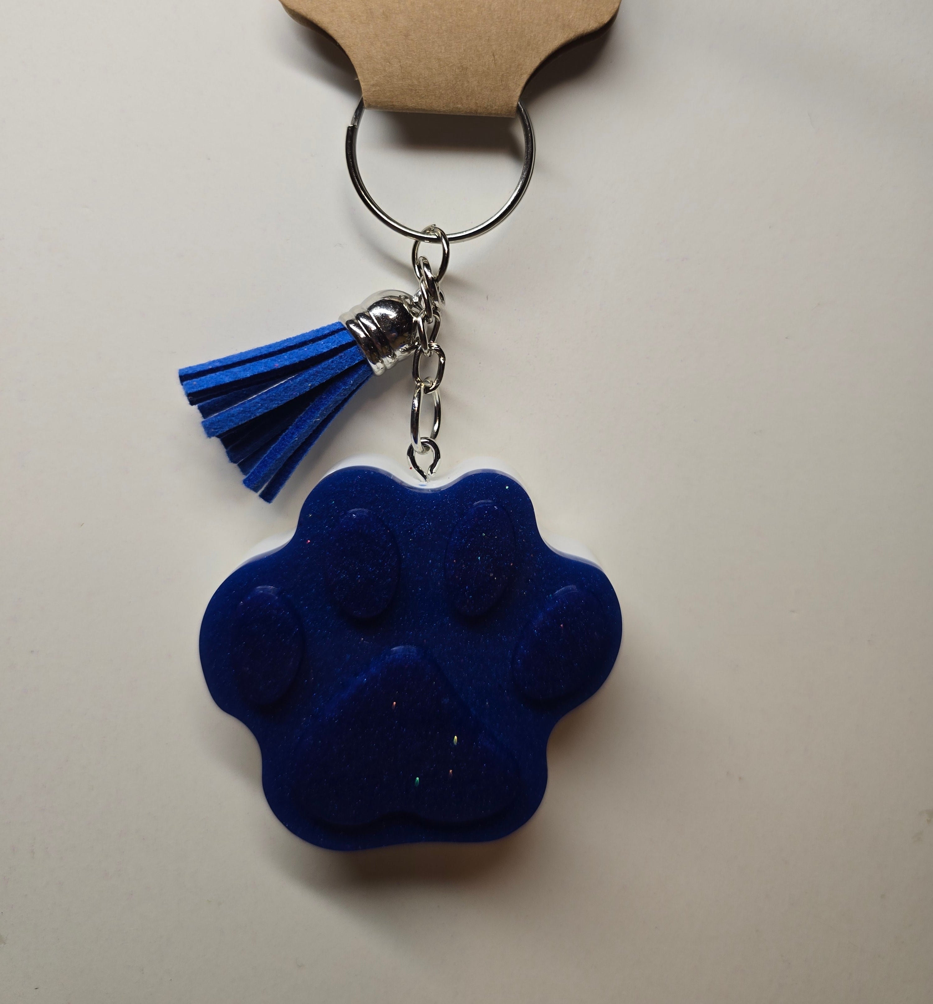 Blue and white paw keychain