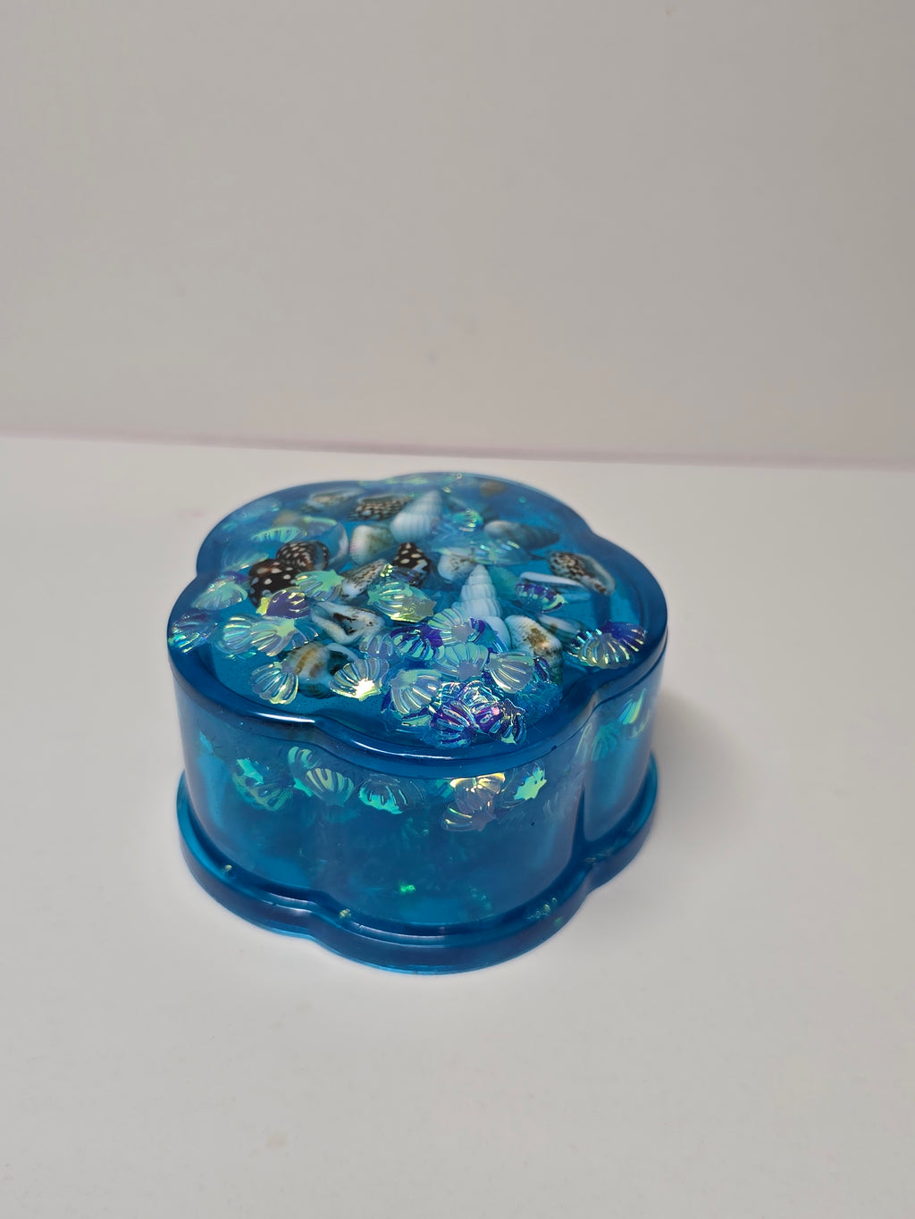 Blue trinket jar with shells