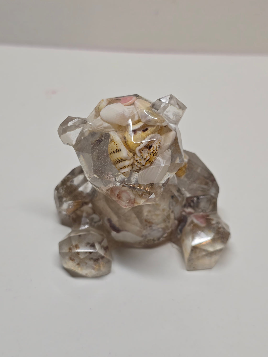 Bear figurine with seashells