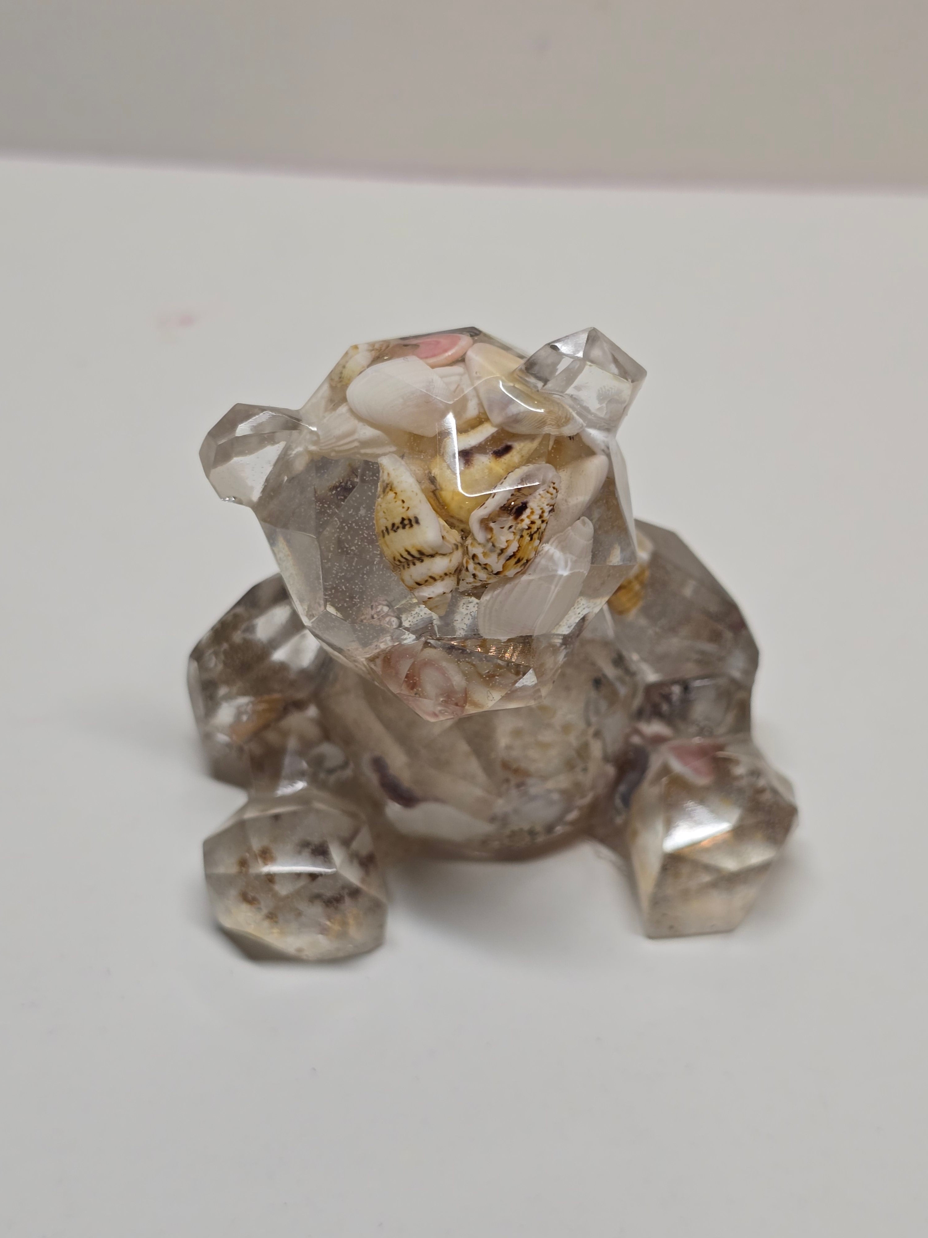 Bear figurine with seashells